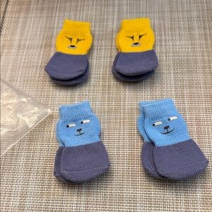 non-slip pet socks with cartoon animal faces, designed for use indoors